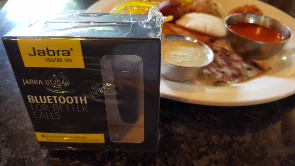 Jabra BT2036 Bluetooth headset box in front of Indian breakfast